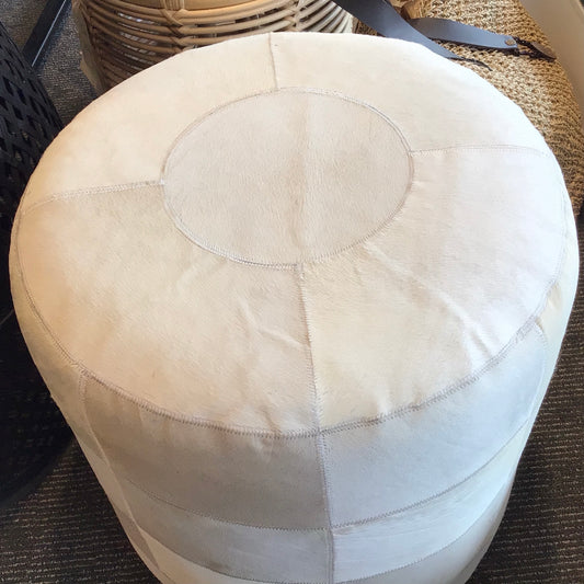 Beautiful cow hide stool, in natural varying shades of white. Strong and versatile, great as small side table, or extra seating.